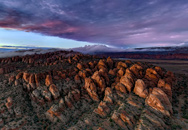 Sunset over sandstone fins of Behind the Rocks.