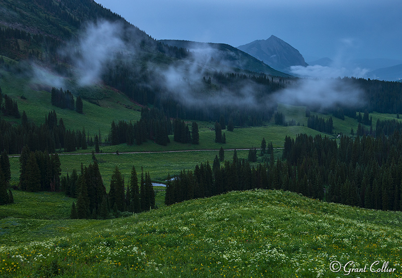 Clouds float below Crested Butte