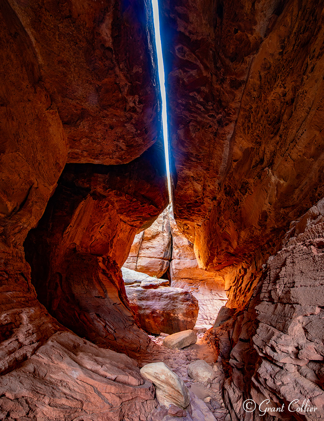 A fascinating slot canyon cuts between sandstone fins along the Joint Trail in the Needles District of Canyonlands National Park.