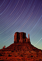 Star trails over Monument Valley