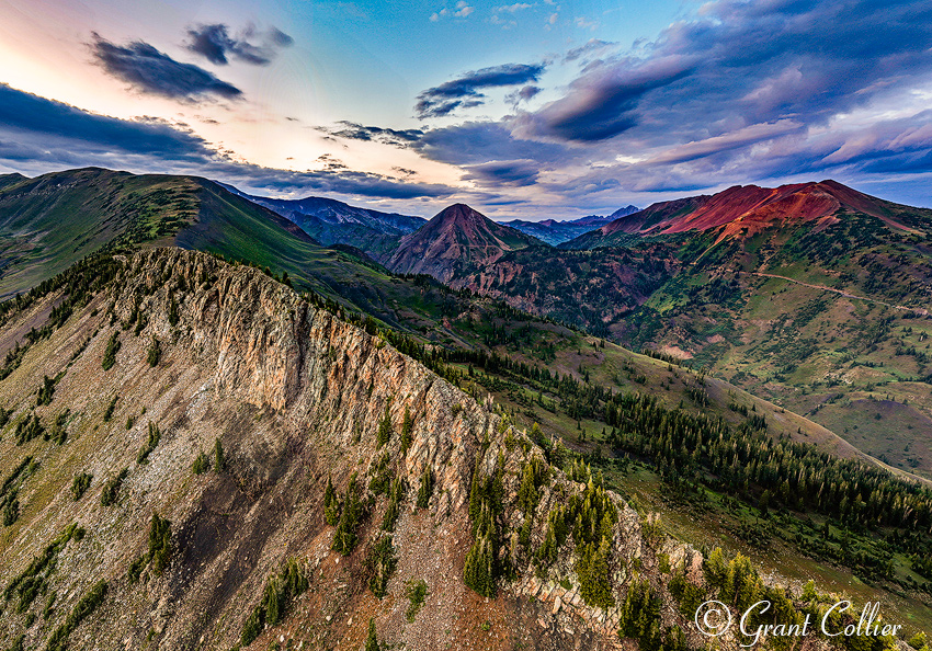 Mount Baldy and Cinnamon Mountain are seen from the air during twilight.