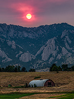 Red Sun from Smoke over Colorado Barn